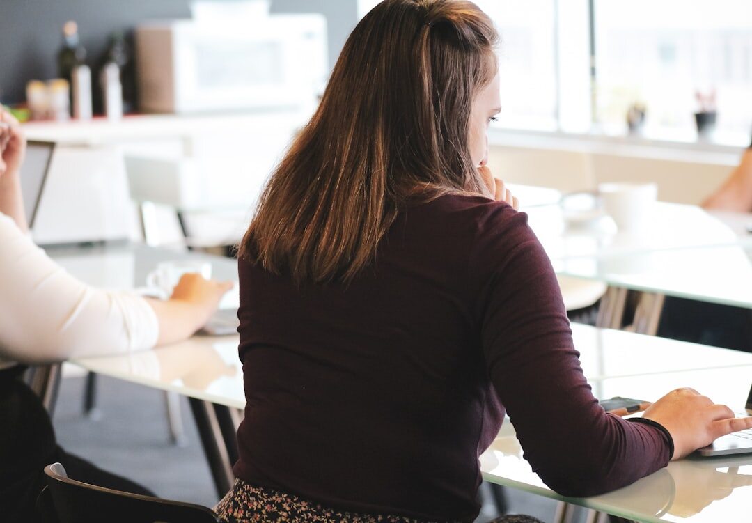 Diverse team of consultants discussing strategy around a table in a modern office